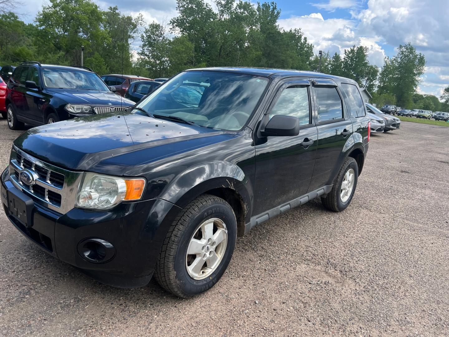 2011 Black Ford Escape XLS 4WD AT (1FMCU9C77BK) with an 2.5L L4 DOHC 16V engine, 6-Speed Automatic transmission, located at 17255 hwy 65 NE, Ham Lake, MN, 55304, 0.000000, 0.000000 - Photo#0